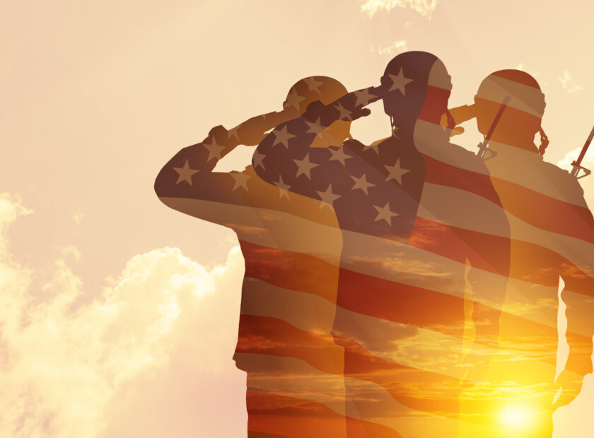 Silhouettes of soldiers with print of sunset. Greeting card for Veterans Day, Memorial Day, Independence Day.